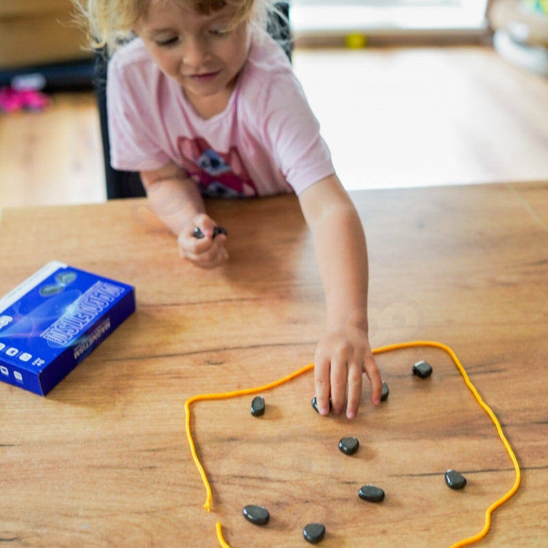 “Pievilksies vai Nē?”  Magnētisko Akmeņu Spēle