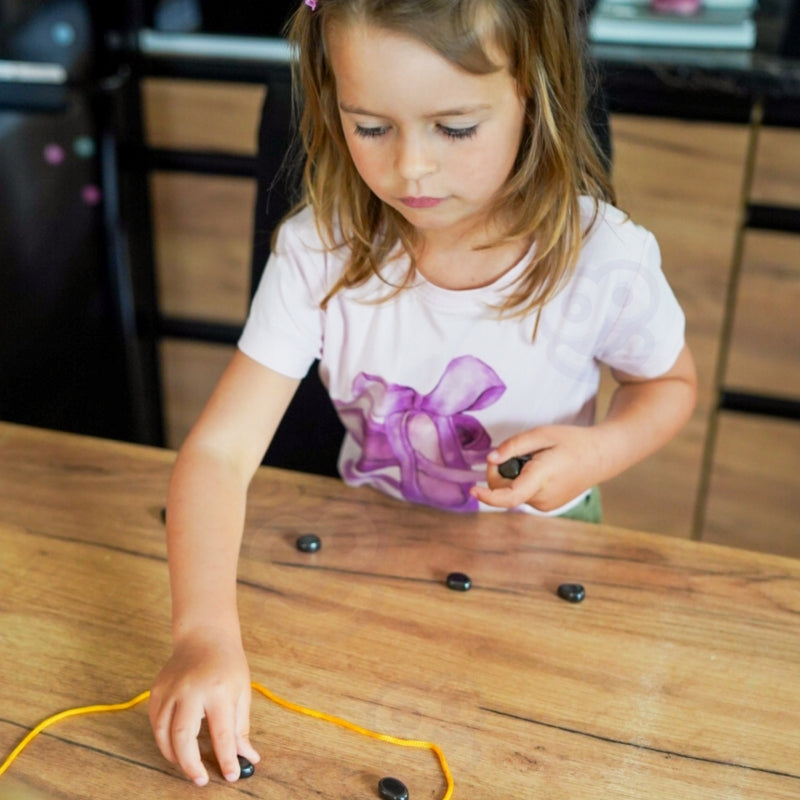 “Pievilksies vai Nē?”  Magnētisko Akmeņu Spēle